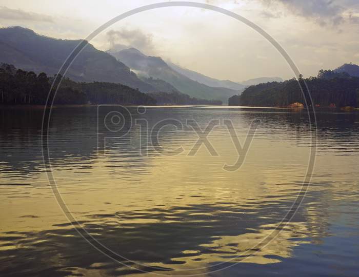 Landscape of calm lake with mountain layers