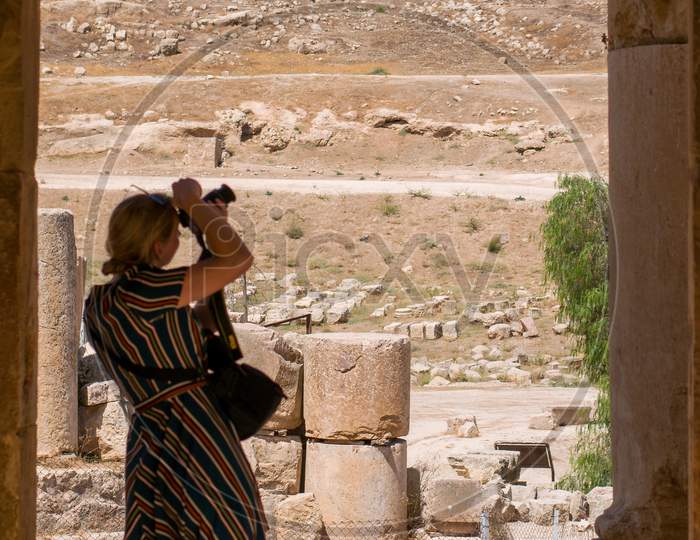 A Tourist photographing the ruins- Jerash visitor center