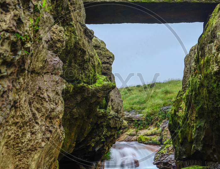 A Stone bridge along the waterfalls