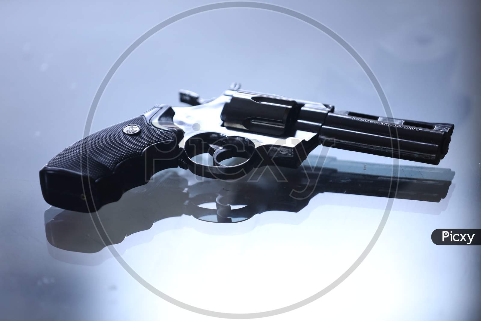 Pistol Or Gun  On an White Table Background