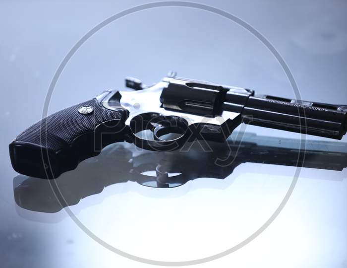 Pistol Or Gun  On an White Table Background