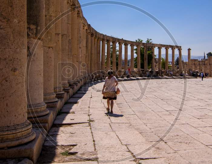Tourist strolling through the Oval Plaza- Jerash visitor center