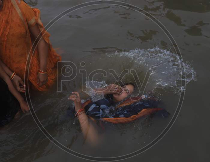 Crowd of Hindu Devotees Taking Holy Bath  At Triveni Sangam River In Prayagraj  During Magh Mela 2020