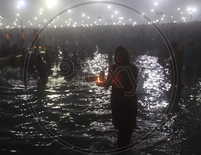 Crowd Of Hindu Devotees Taking Holy Bath  At Triveni Sangam River In Prayagraj  During Magh Mela 2020