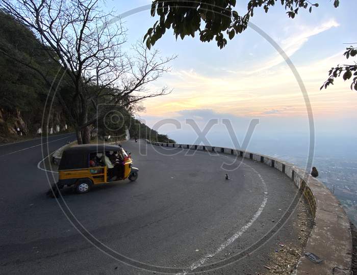 Indian auto moving along the ghat road
