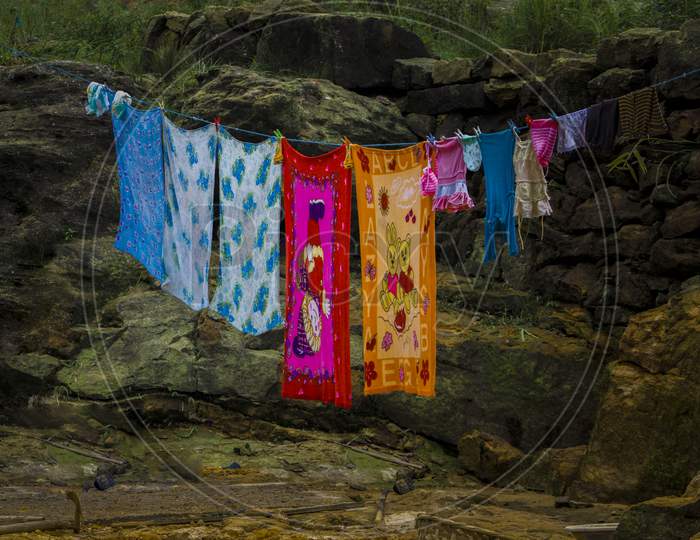 View of clothes hung onto the rope
