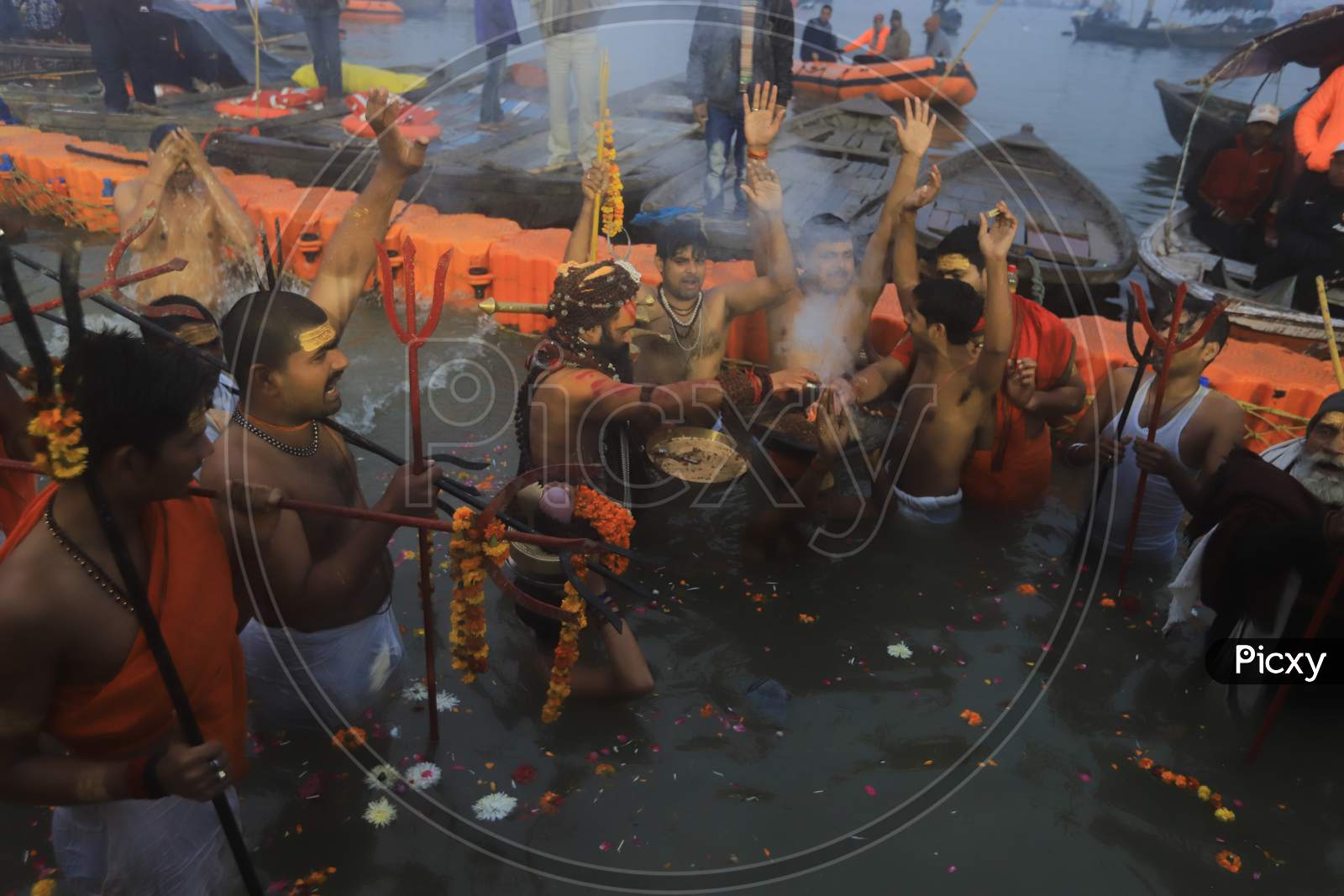 Hindu Baba Or Sadhu Taking Holy Bath  At Triveni Sangam River In Prayagraj  During Magh Mela 2020