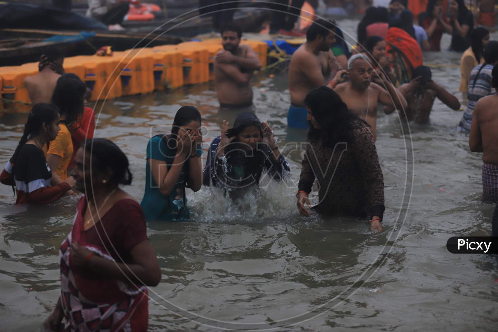 Crowd of Hindu Devotees Taking Holy Bath  At Triveni Sangam River In Prayagraj  During Magh Mela 2020