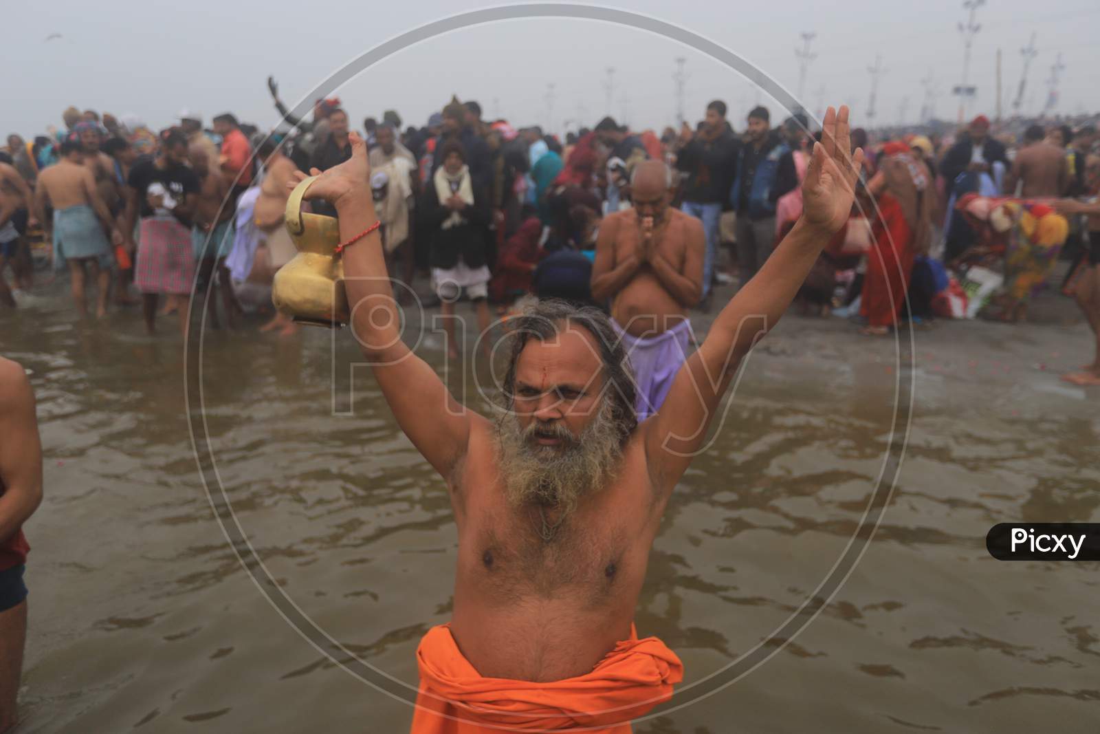 Hindu Baba Or Sadhu  Taking Holy Bath  At Triveni Sangam River In Prayagraj  During Magh Mela 2020