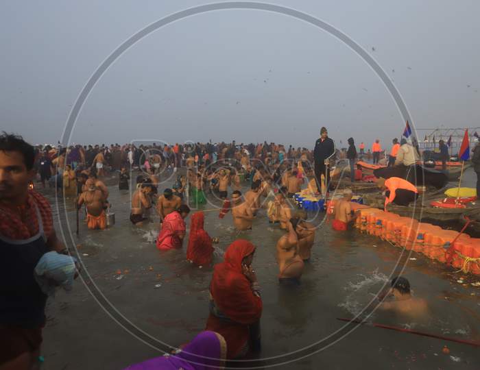 Hindu Baba Or Sadhu Taking Holy Bath  At Triveni Sangam River In Prayagraj  During Magh Mela 2020