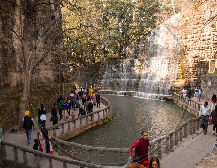 people visiting waterfall at rock garden chandigarh