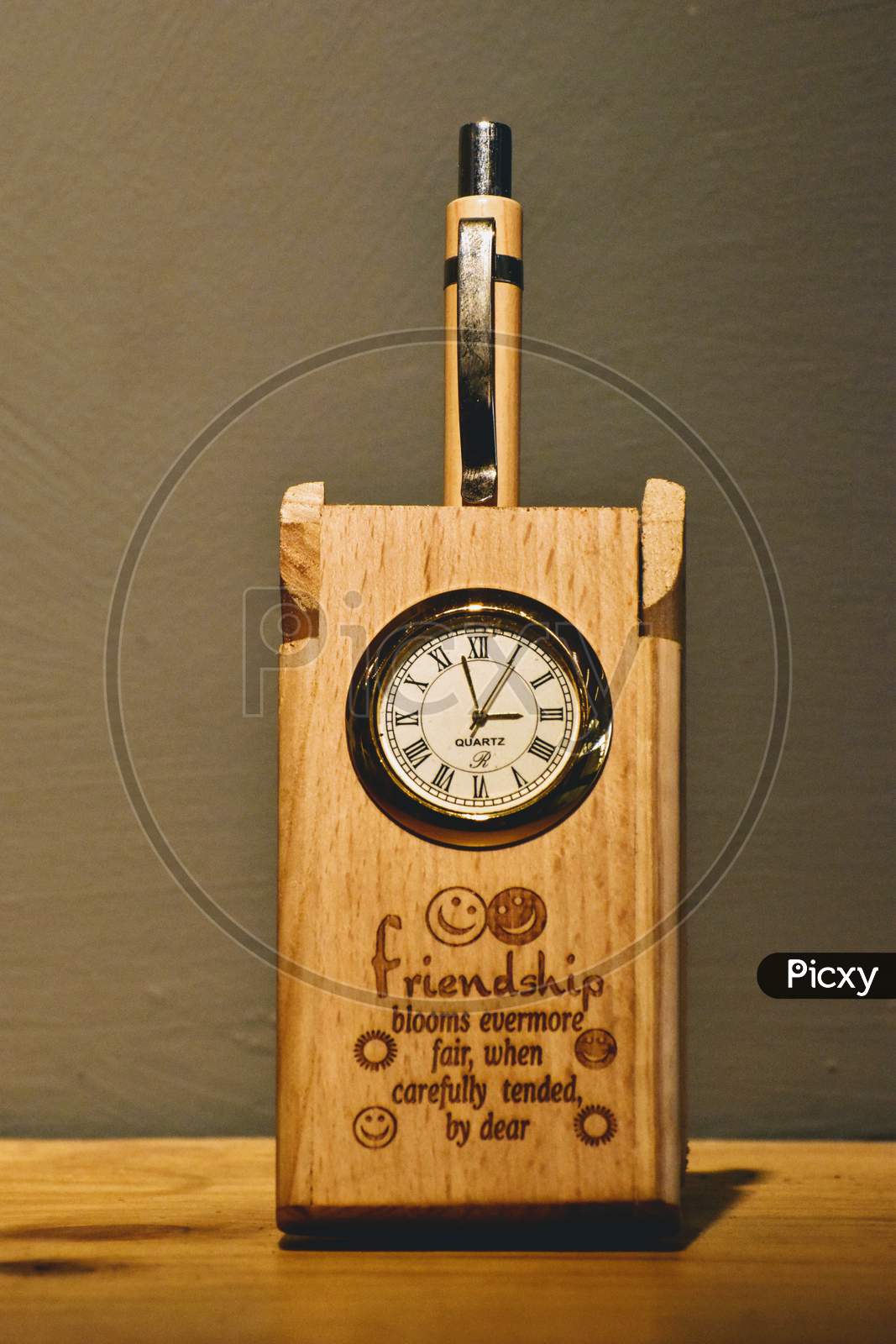 Pen holder and clock