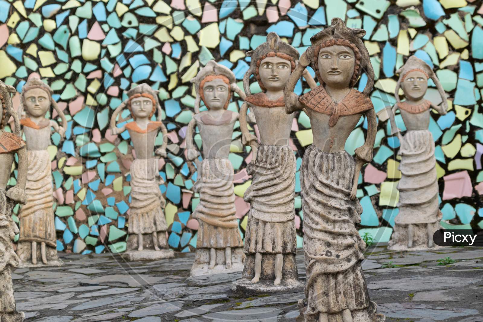 sculptures and decorated wall with broken tiles at rock garden chandigarh