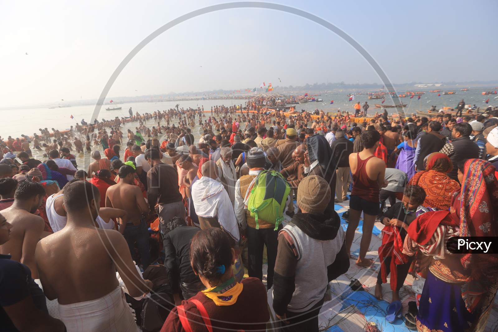 Crowd Of Indian Devotees Taking Holy Bath in Triveni Sangam River At Prayagraj During Magh Mela 2020