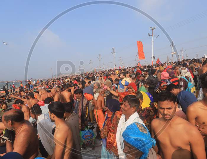 Crowd Of Indian Devotees Taking Holy Bath in Triveni Sangam River At Prayagraj During Magh Mela 2020