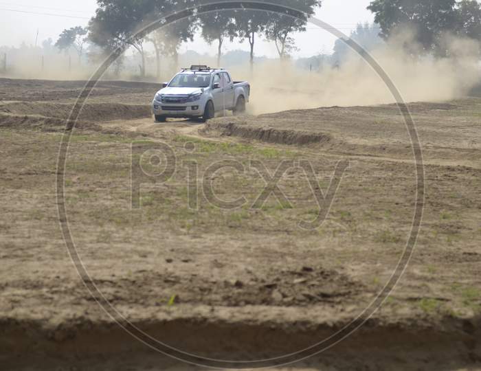 Car Off-Road in an Rally Championship  With Drifting And Sand and Soil  Splashes on Rally Tracks