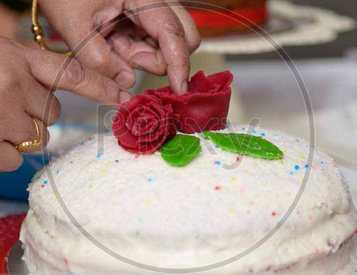 Chef Decorating  Cake With Cheese Cream