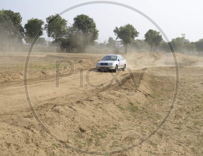 Car Off-Road in an Rally Championship  With Drifting And Sand Splashes on Rally Tracks