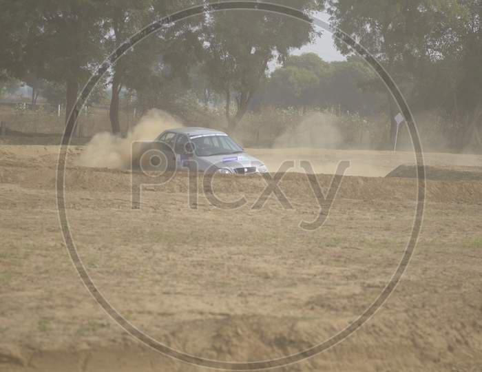Car Off-Road in an Rally Championship  With Drifting And Sand Splashes on Rally Tracks