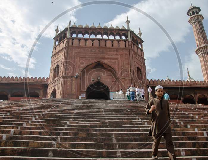 View of tourists walking along the steps of Jama Masjid