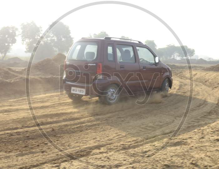 View of A Maruti Suzuki Wagon R Car in the dirt road