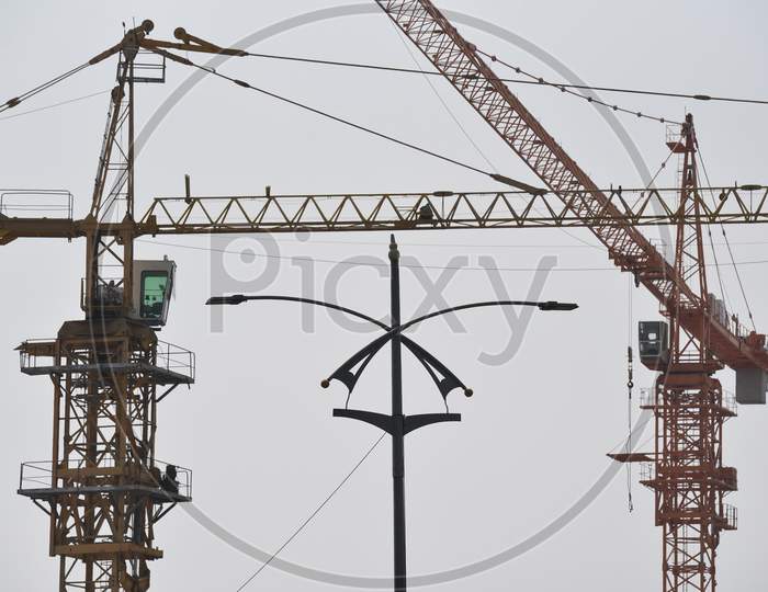 Huge tower cranes at a construction site