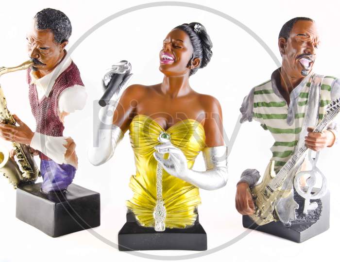 Musicians Idols Or Statues On an Isolated White Background