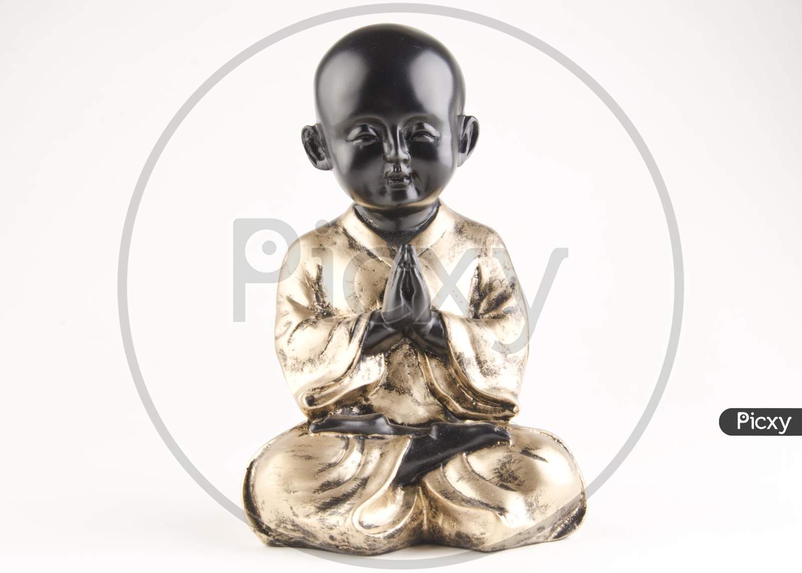 Chinese Boy Statue With Namaste Gesture Over An Isolated White Background
