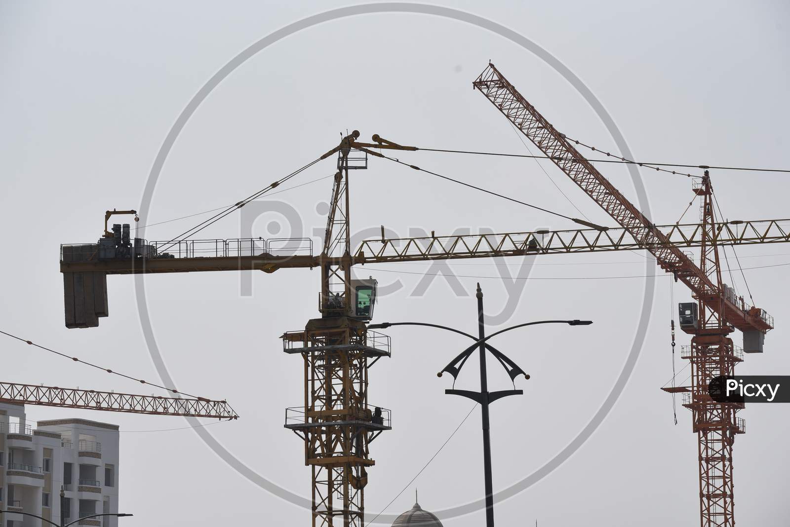 Huge tower cranes at a construction site
