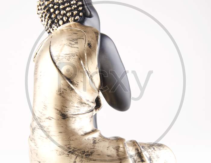 Budda Idol Or Figurine  Over An Isolated White Background
