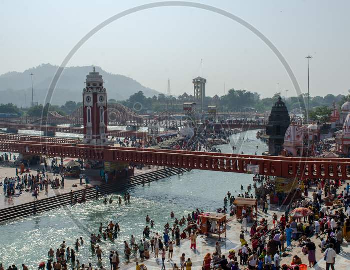 Haridwar With Ganges River Channel And Devotees Taking Holy Bath  In Gnaga River , Uttarakhand