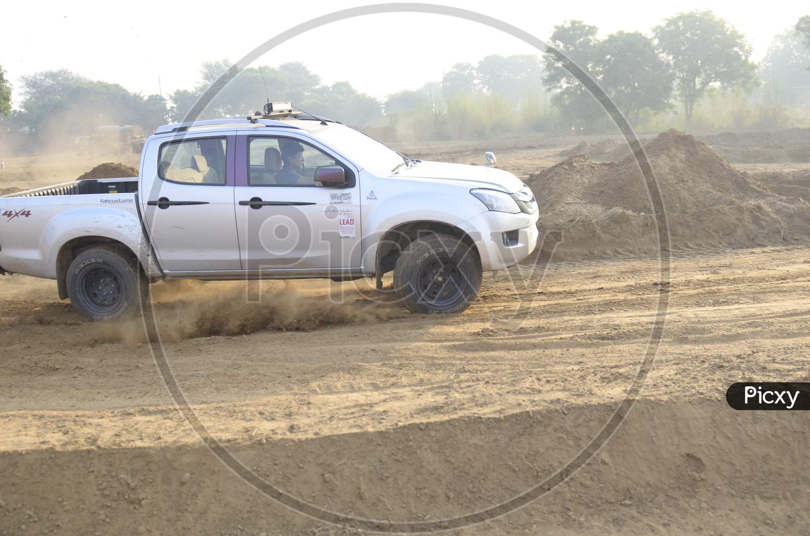 ISUZU Car Or  Off-Road Vehicle  in an Rally Championship  With Drifting And Sand and Soil  Splashes on Rally Tracks