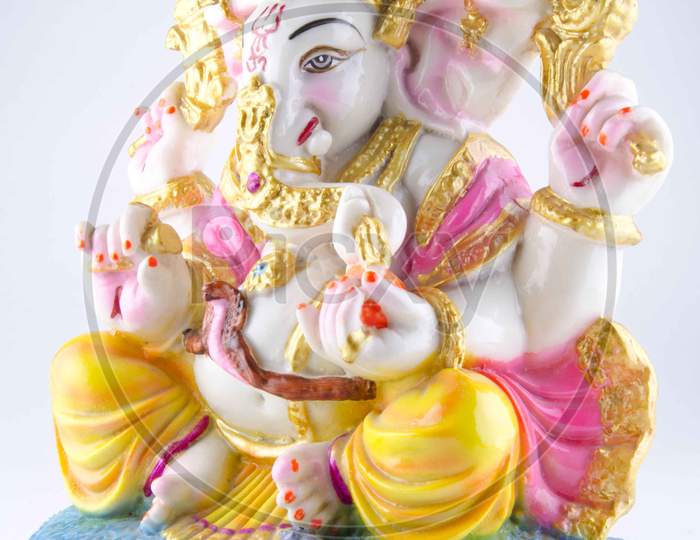 Indian Hindu God Lord Ganesh Idols Over An Isolated White Background