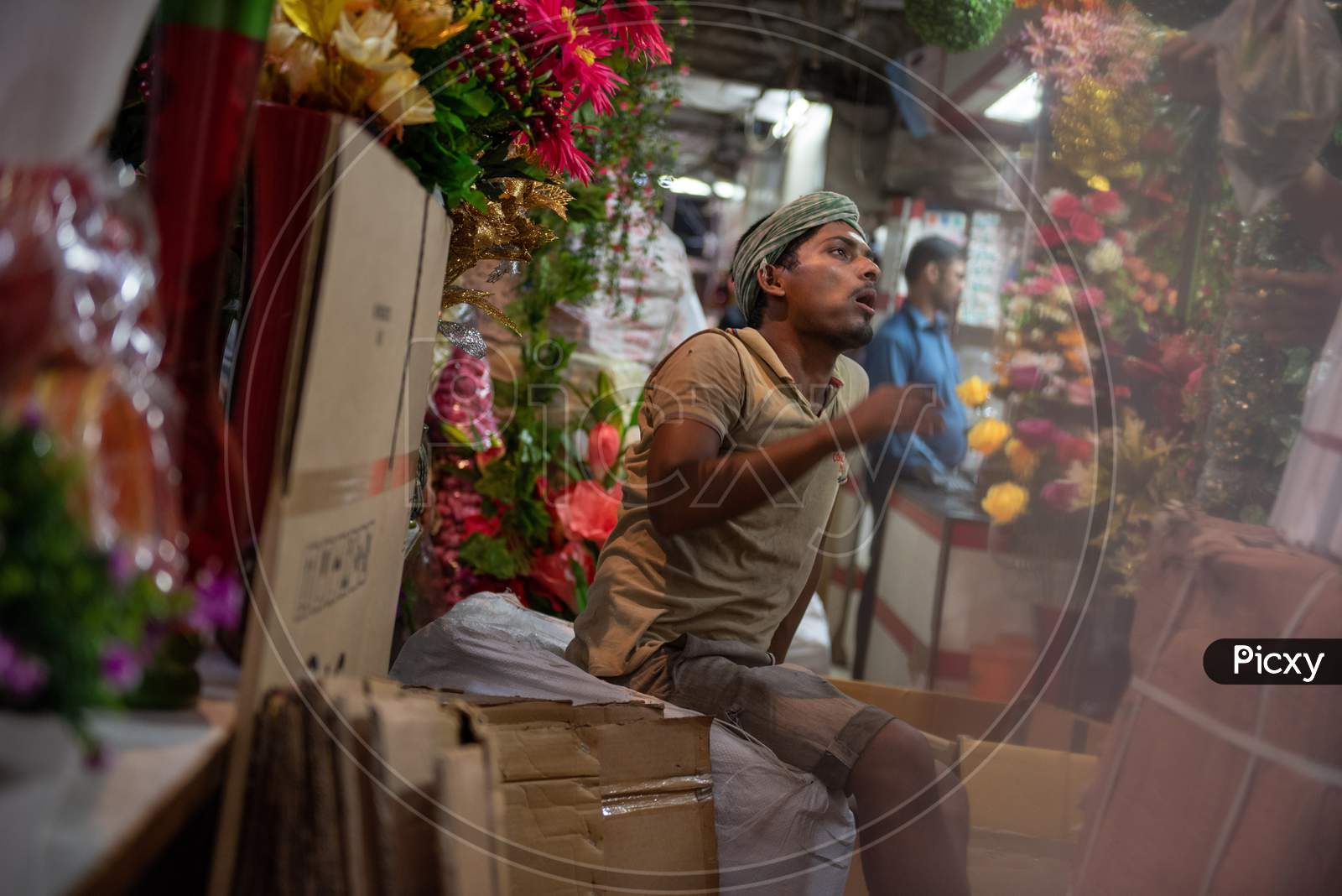 Indian flower vendor in the street market