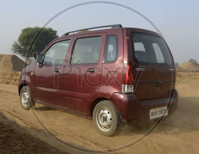 Suzuki WagonR Car Or  Off-Road Vehicle  in an Rally Championship  With Drifting And Sand and Soil  Splashes on Rally Tracks