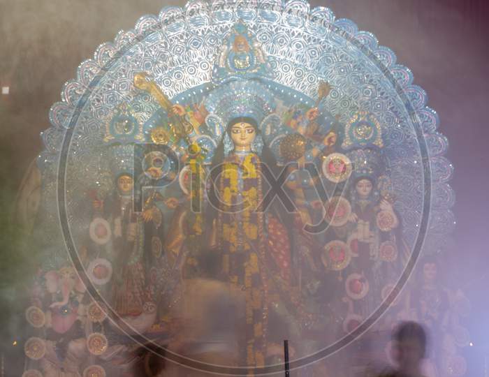 Goddess Durga Devi Statue covered in smoke