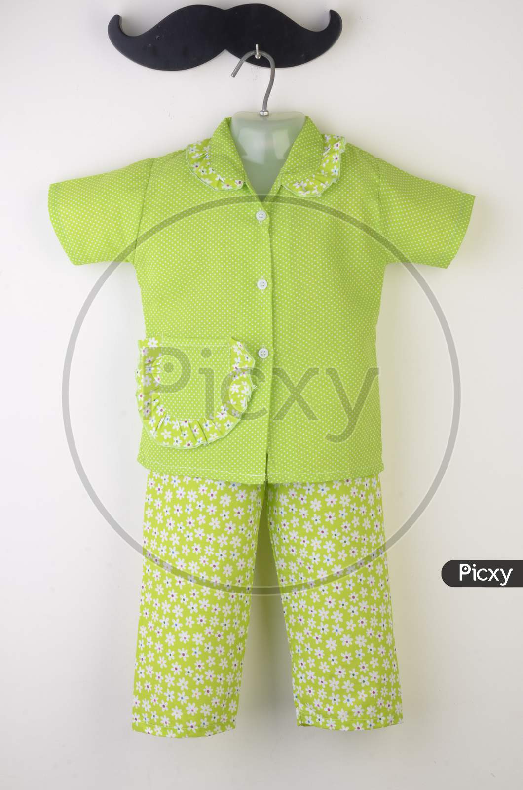 Kids Night Wear Paijama Over An Isolated White Background