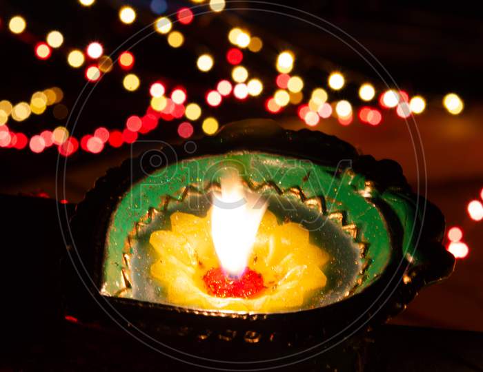 Diwali Dia With LED Bokeh Background