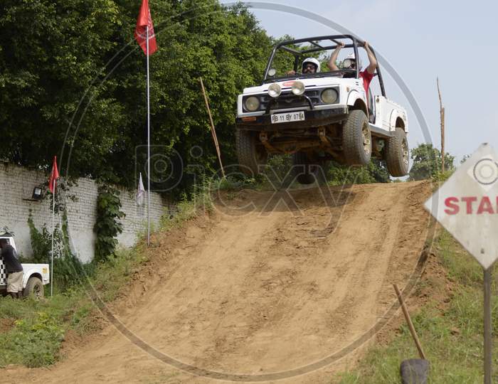 Off-Road Vehicle  in an Rally Championship  With Drifting And Sand and Soil  Splashes on Rally Tracks