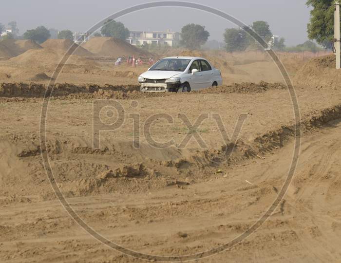 A Damaged car during rally race in the dirt road