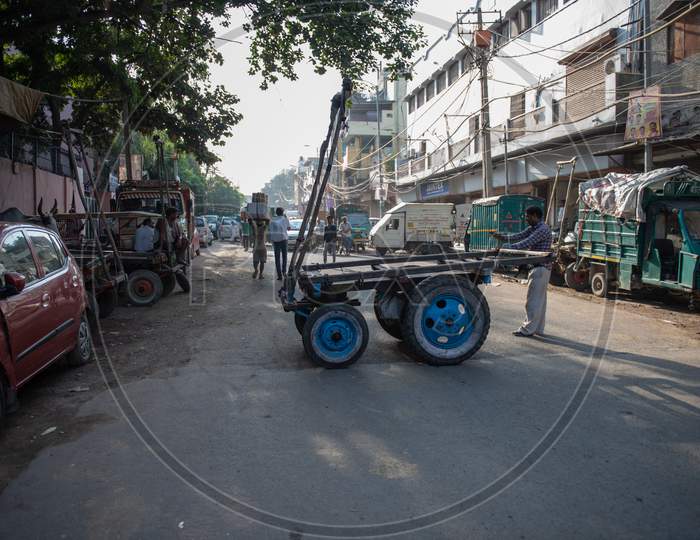 Indian Man pulling cart