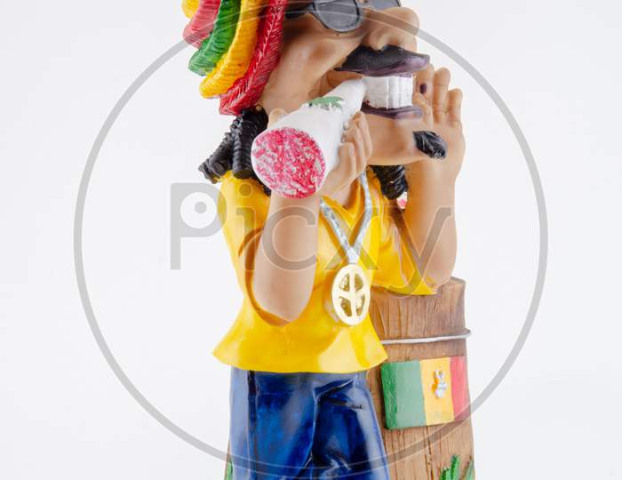 Action Figure or A Toy With  Things Holder Over an Isolated White Background