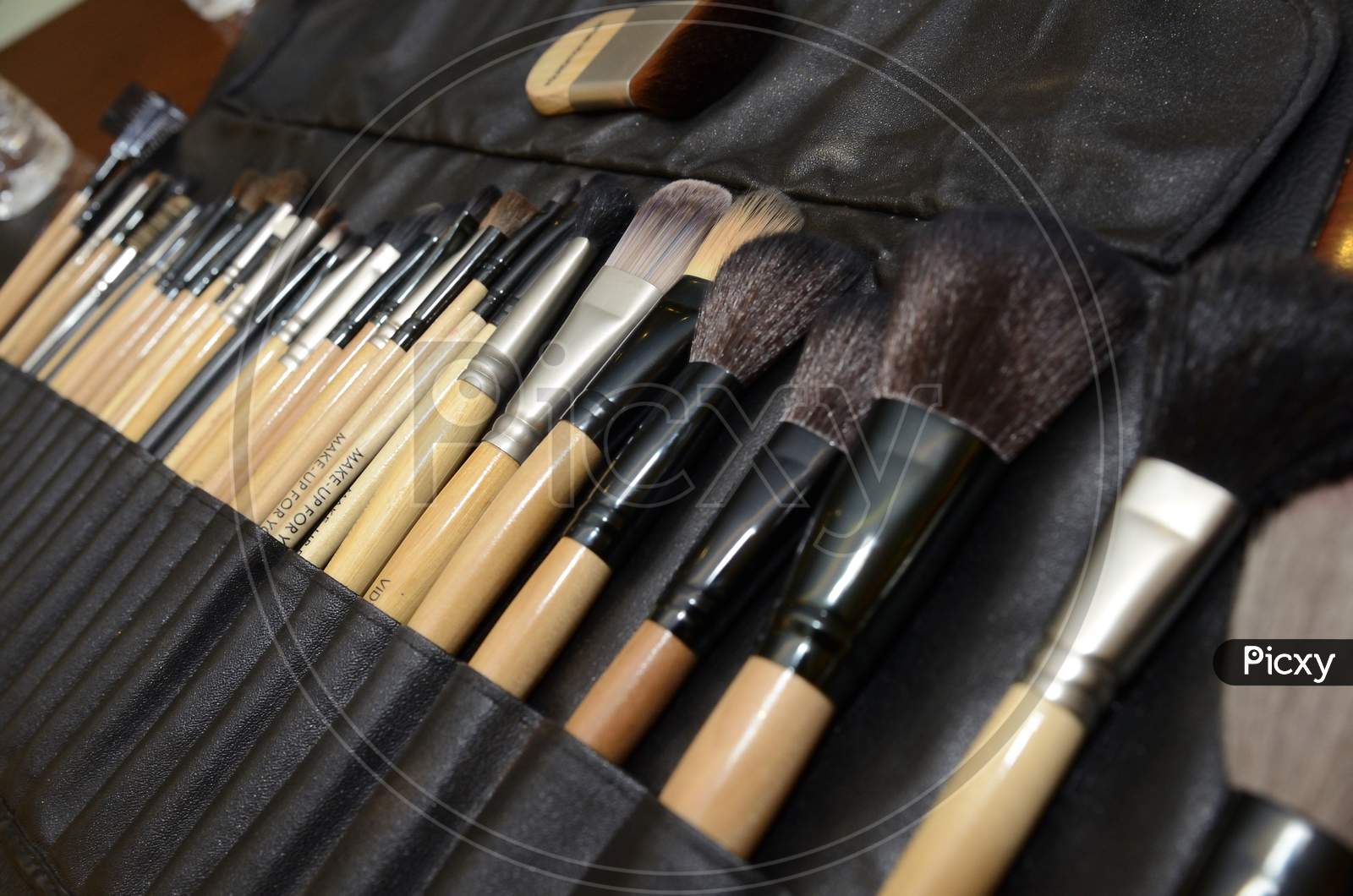 Professional Makeup Kit With  Brushes Closeup On a Table