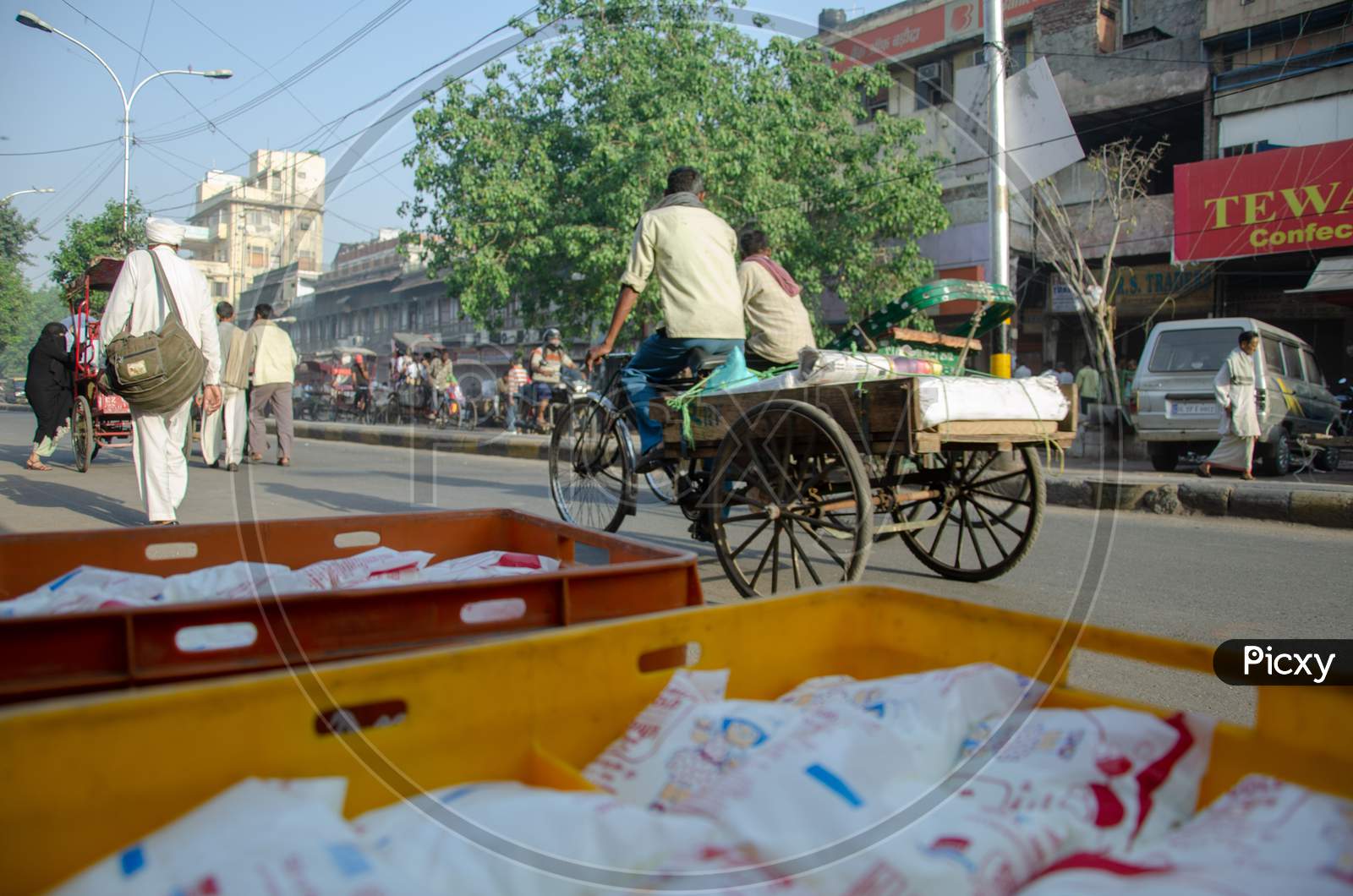 Indian man riding rickshaw
