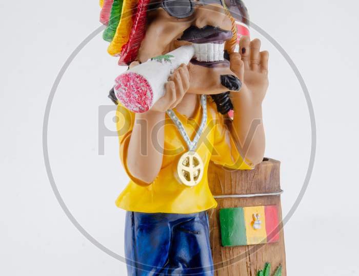 Action Figure or A Toy With Things Holder Over an Isolated White Background