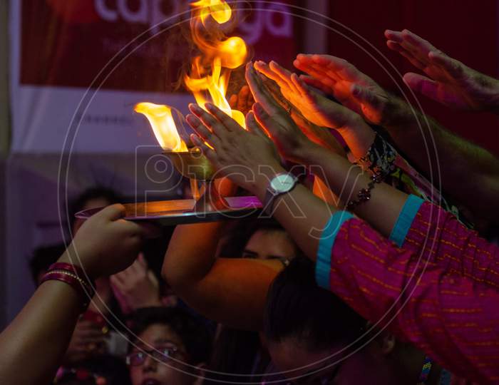 Indian devotees receiving harathi during worship