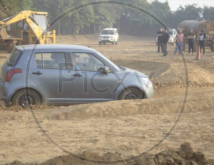 View of Maruti Suzuki Swift making a drift