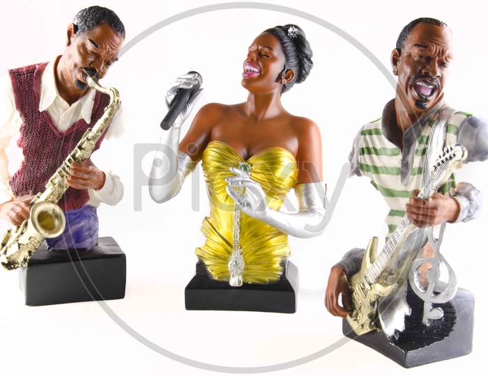 Musicians Idols Or Statues On an Isolated White Background