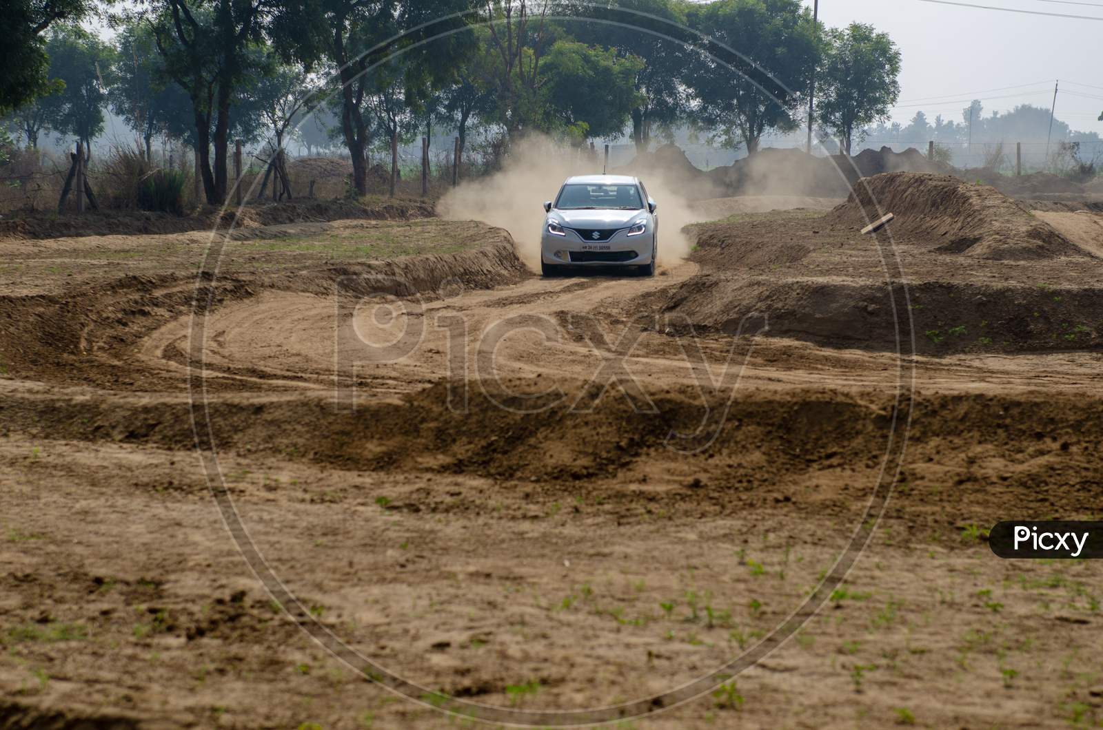 Car Or  Off-Road Vehicle  in an Rally Championship  With Drifting And Sand and Soil  Splashes on Rally Tracks