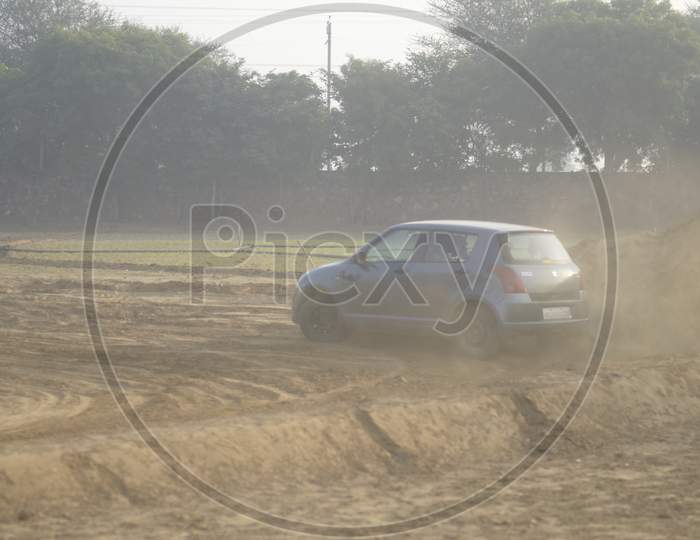 View of Maruti Suzuki Swift taking a turn